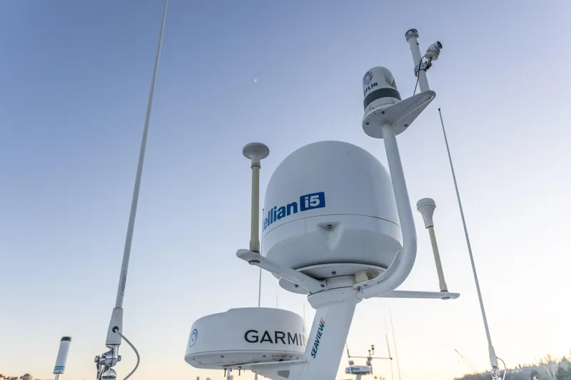Slide: The Image of Satellite and radar equipment on 2021 North Pacific 49 Pilothouse boat under clear sky. - 38