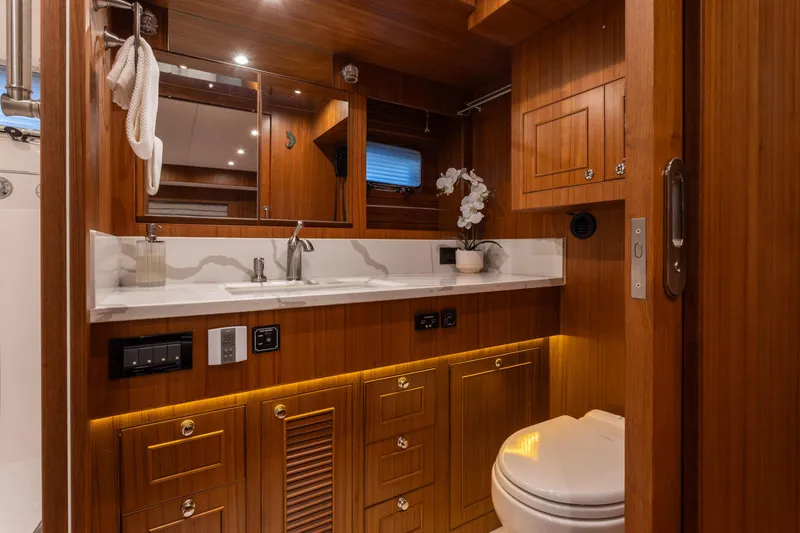 Slide: The Image of Luxurious wooden bathroom interior of 2021 North Pacific 49 Pilothouse yacht. - 9
