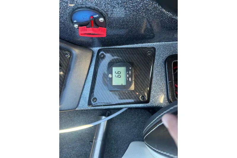 Slide: The Image of Dashboard of 2021 Phoenix 818 Pro with digital display and control knob. - 11