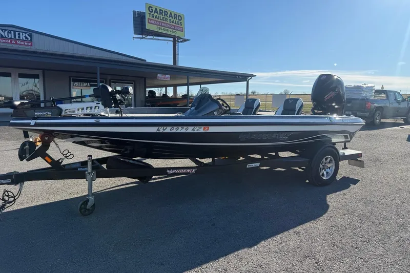 Slide: The Image of 2021 Phoenix 818 Pro boat on trailer at dealership, sunny day. - 3