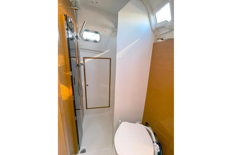Slide: The Image of Bathroom interior of 2017 Jeanneau Sun Odyssey 349 yacht, featuring shower and toilet. - 11