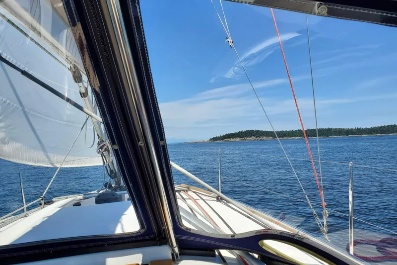 Slide: The Image of Sailing view from Jeanneau Sun Odyssey 349, 2017, on a clear day near an island. - 15