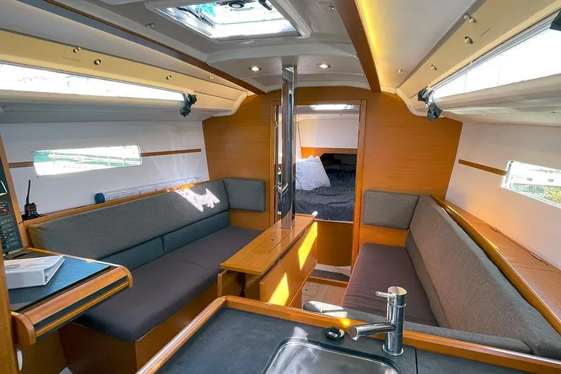 Slide: The Image of 2017 Jeanneau Sun Odyssey 349 interior with cozy seating and modern design. - 2