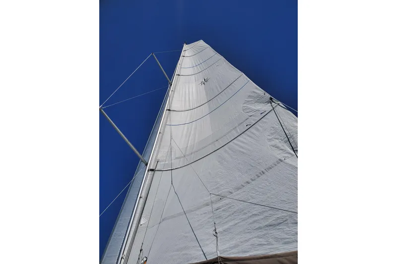 Slide: The Image of Sail of 2017 Jeanneau Sun Odyssey 349 against clear blue sky. - 24