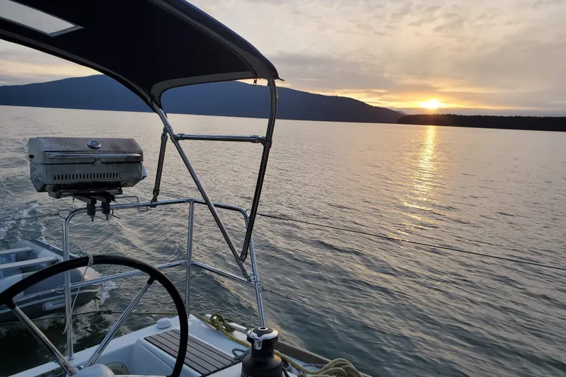 Slide: The Image of Jeanneau Sun Odyssey 349 sailing at sunset, 2017 model, serene lake view. - 28