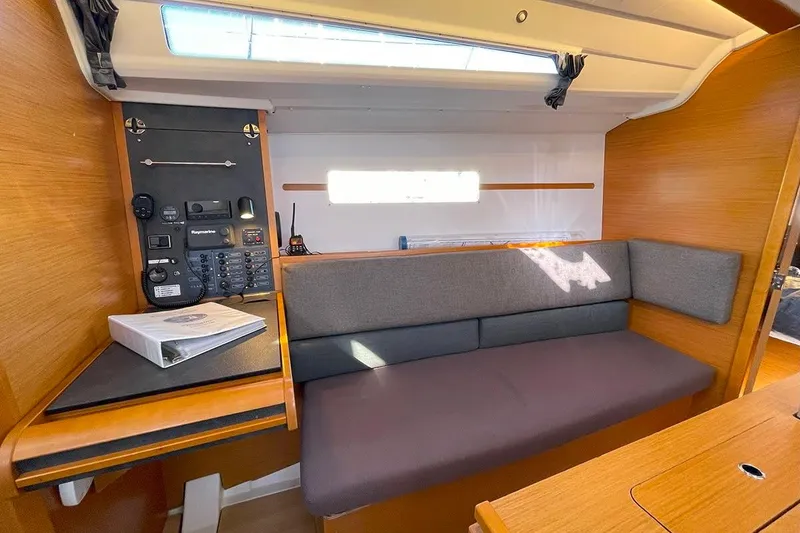 Slide: The Image of Interior of 2017 Jeanneau Sun Odyssey 349 sailboat with navigation station and seating area. - 4