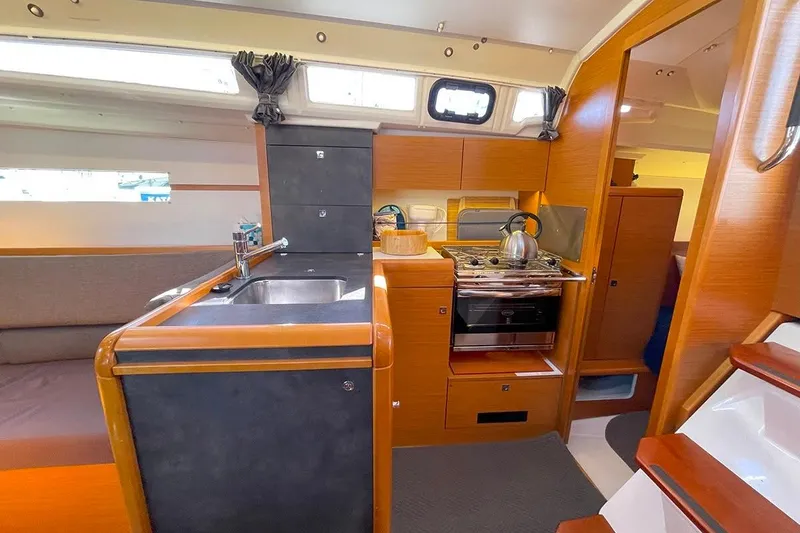 Slide: The Image of Interior of 2017 Jeanneau Sun Odyssey 349 yacht with modern kitchen amenities. - 6