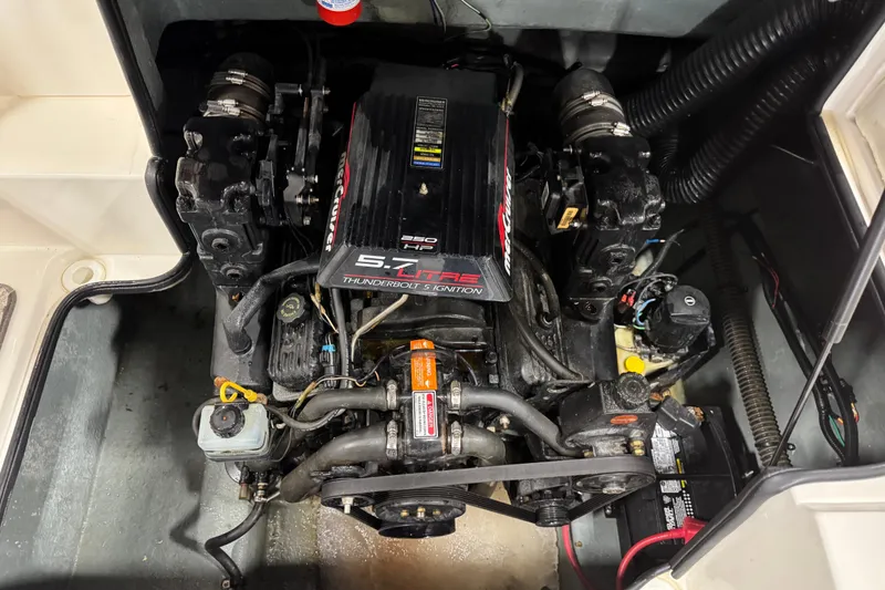 Slide: The Image of Engine compartment of a 1998 Sea Ray 240 Sundeck with MerCruiser 5.7L engine. - 13