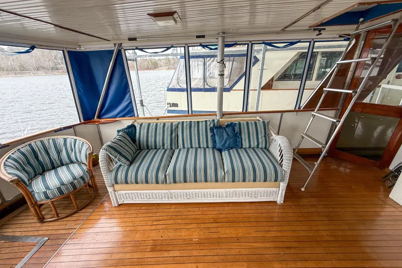 Slide: The Image of 1956 Burger Pilothouse interior with striped seating, wooden floor, and ladder. - 20