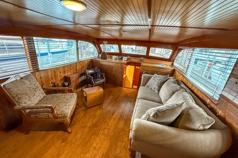 Slide: The Image of Luxurious 1956 Burger Pilothouse interior with wood paneling and comfortable seating. - 27