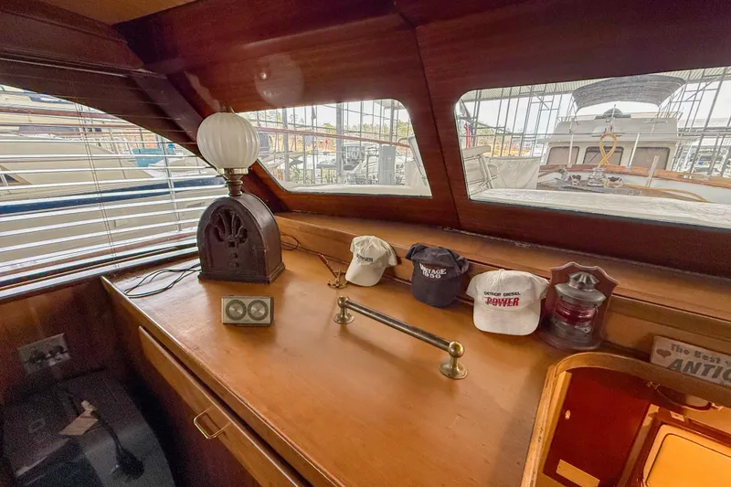 Slide: The Image of 1956 Burger Pilothouse interior with vintage decor and nautical memorabilia. - 30