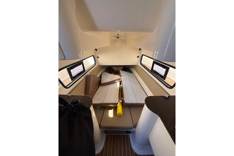 Slide: The Image of 2018 Scout 350 LXF cabin interior with seating and windows. - 16
