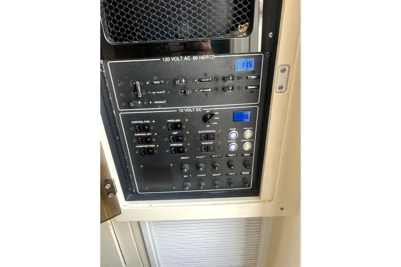 Slide: The Image of Control panel of a 2018 Scout 350 LXF boat, featuring 120V AC and 12V DC systems. - 23