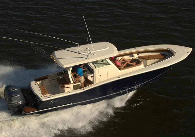 Slide: The Image of Manufacturer Provided Image: 2018 Scout 350 LXF boat cruising on water with passengers. - 3