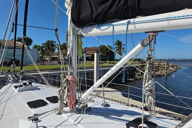 Slide: The Image of 1982 Tayana Center Cockpit Cutter Ketch docked, showcasing rigging and deck details. - 20