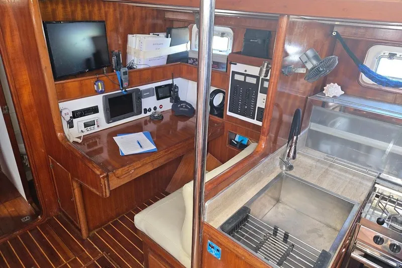 Slide: The Image of Interior of 1982 Tayana Center Cockpit Cutter Ketch with navigation station and galley. - 29
