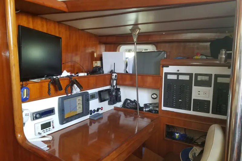 Slide: The Image of 1982 Tayana Center Cockpit Cutter Ketch interior with navigation equipment and control panels. - 3
