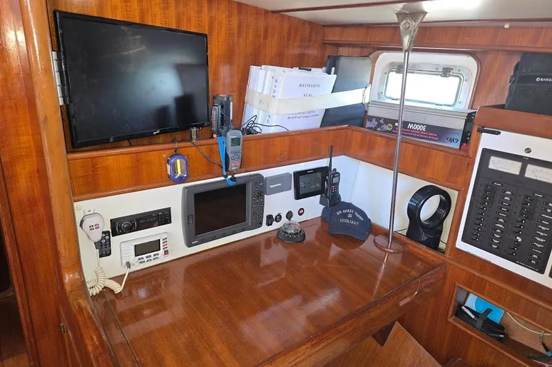 Slide: The Image of Navigation station of 1982 Tayana Center Cockpit Cutter Ketch with electronics and communication equipment. - 30