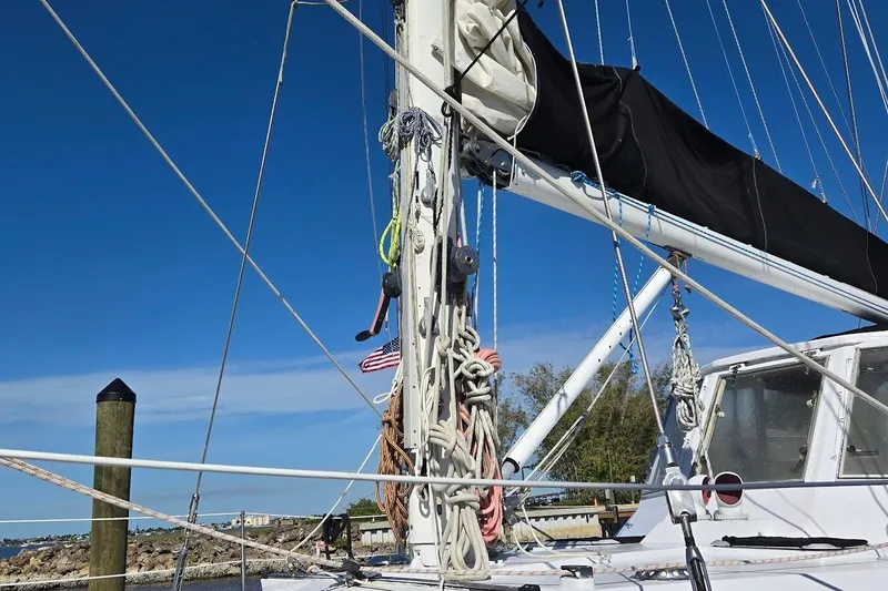 Slide: The Image of 1982 Tayana Center Cockpit Cutter Ketch sailboat with rigging and mast details. - 54