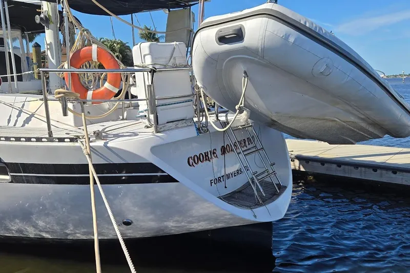 Slide: The Image of 1982 Tayana Center Cockpit Cutter Ketch docked with dinghy and lifebuoy, Fort Myers. - 66
