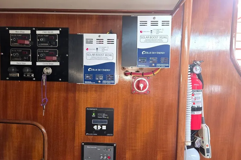 Slide: The Image of Control panel and solar charger in 1982 Tayana Center Cockpit Cutter Ketch interior. - 70