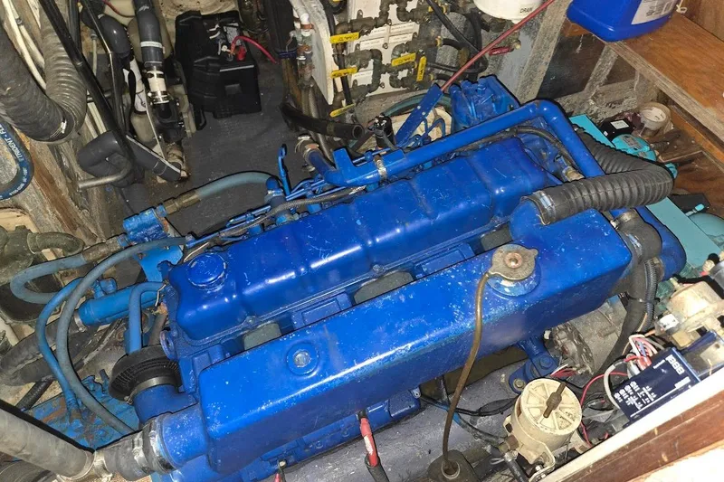 Slide: The Image of Engine room of 1982 Tayana Center Cockpit Cutter Ketch with blue marine engine. - 72