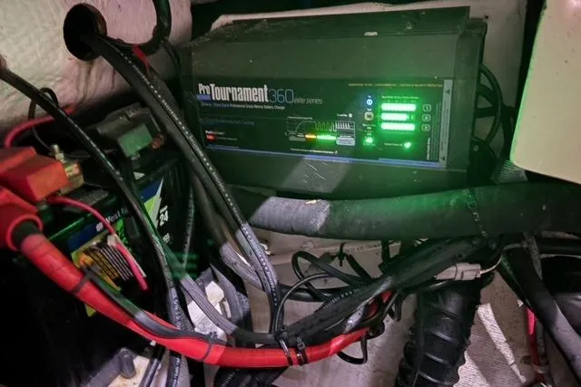 Slide: The Image of Battery charger setup in 2013 Grady-White Express 330 boat, featuring ProTournament 360 system. - 15