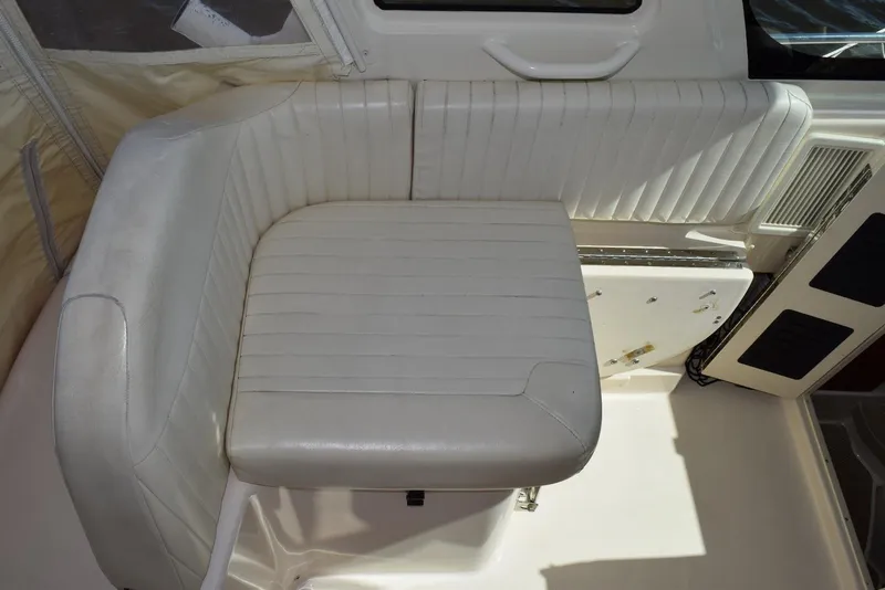 Slide: The Image of 2013 Grady-White Express 330 boat interior with white cushioned seating. - 20