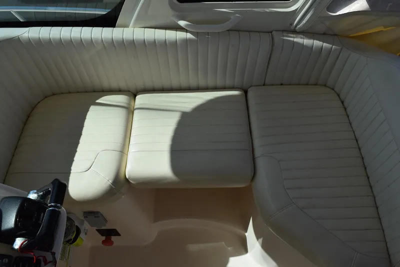 Slide: The Image of 2013 Grady-White Express 330 boat interior with cushioned seating area. - 21
