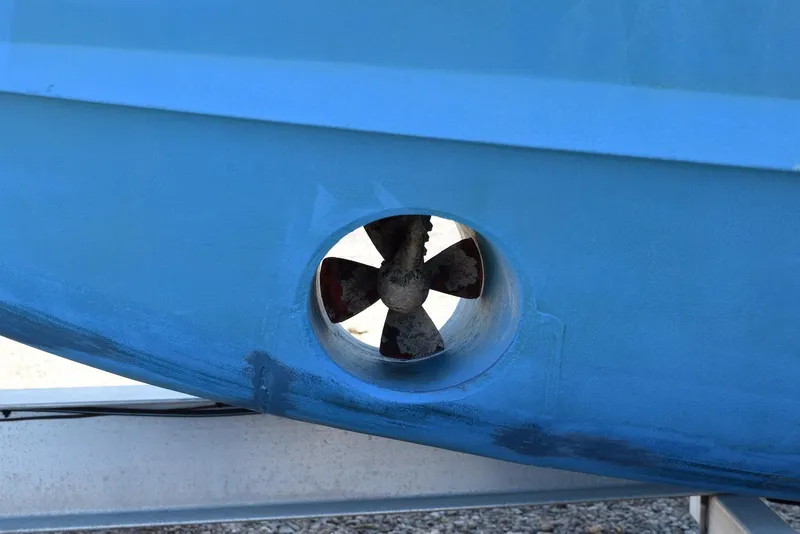 Slide: The Image of Bow thruster on a 2013 Grady-White Express 330 boat hull. - 29