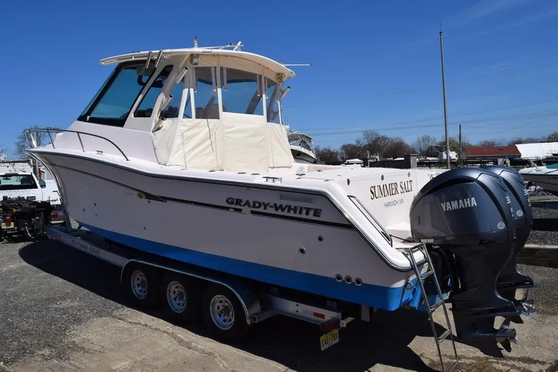 Slide: The Image of 2013 Grady-White Express 330 boat with Yamaha engines on a trailer. - 32