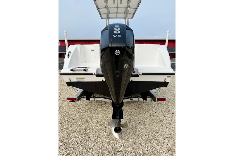 Slide: The Image of 2023 Aquasport 220 CC boat with powerful V6 engine, rear view. - 32