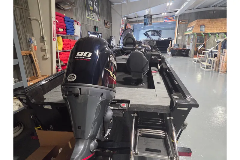 Slide: The Image of 2026 Starcraft Starfire 160 SC boat with 90 horsepower engine in showroom. - 7