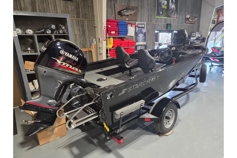 Slide: The Image of 2026 Starcraft Starfire 160 SC boat with Yamaha VMAX engine in showroom. - 8