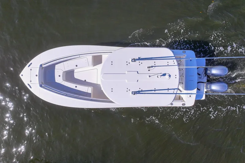 Slide: The Image of Aerial view of 2014 Regulator 25 boat cruising on water. - 17