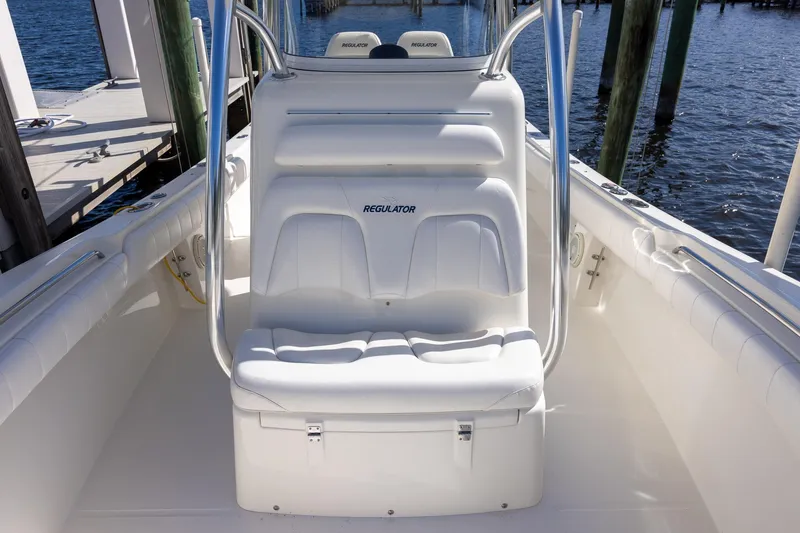 Slide: The Image of 2014 Regulator 25 boat console with Garmin displays and steering wheel. - 22