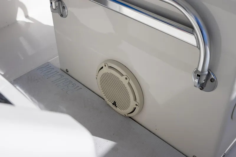 Slide: The Image of 2014 Regulator 25 boat interior with speaker and stainless steel handle. - 34