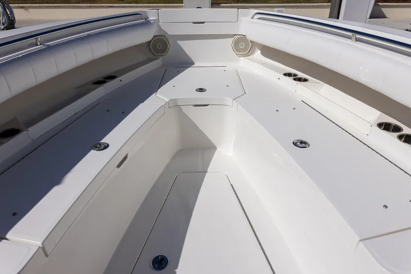 Slide: The Image of 2014 Regulator 25 boat interior with spacious seating and cup holders. - 40