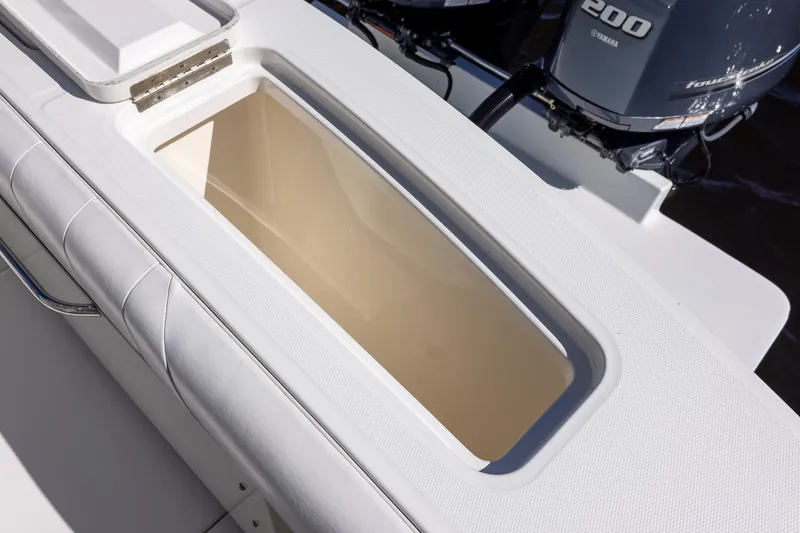 Slide: The Image of 2014 Regulator 25 boat with open storage compartment and Yamaha 200 engines. - 44