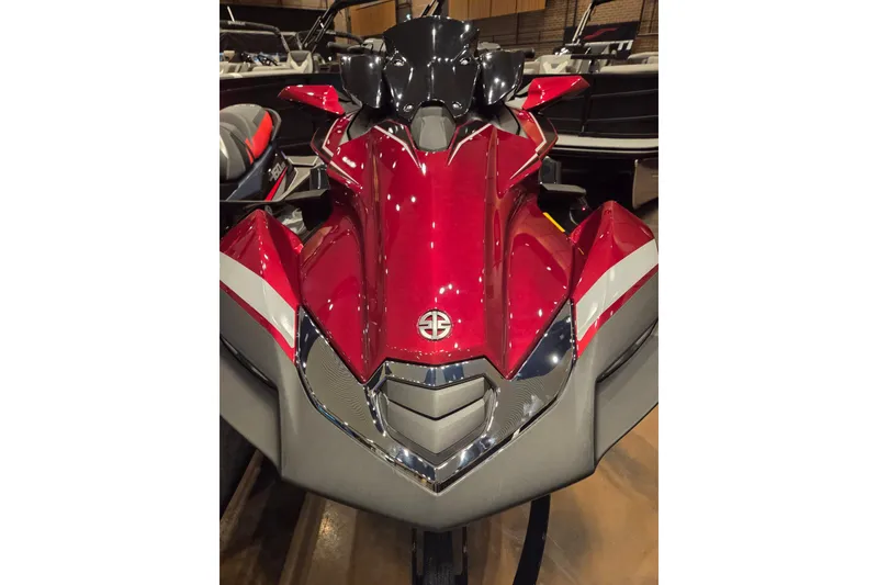 Slide: The Image of 2026 Kawasaki Ultra 310LX jet ski, red and sleek design, front view. - 2