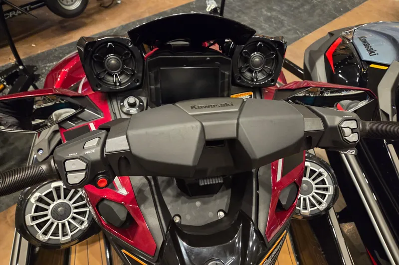 Slide: The Image of 2026 Kawasaki Ultra 310LX dashboard with advanced controls and speakers. - 4