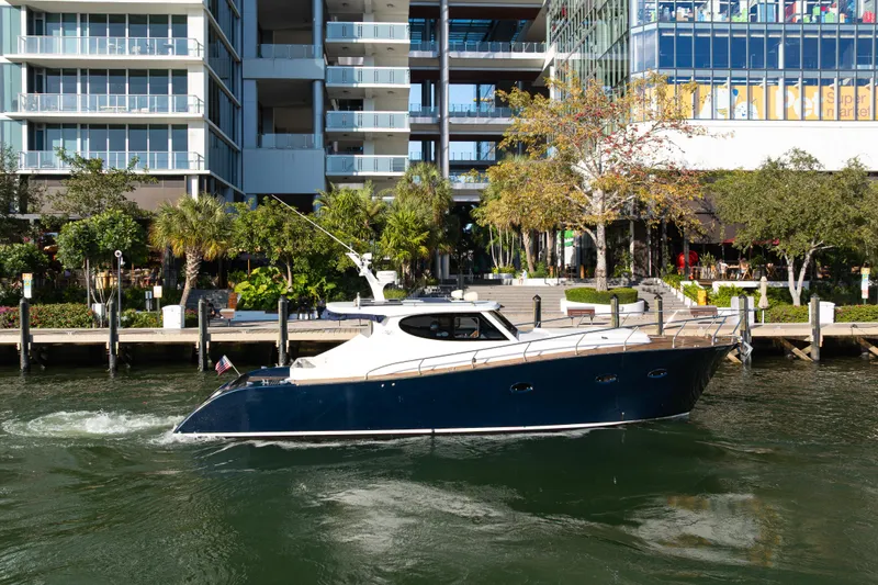 The Image of Custom NNS Sea Scout 41 yacht from 2007 near modern architecture. - 0