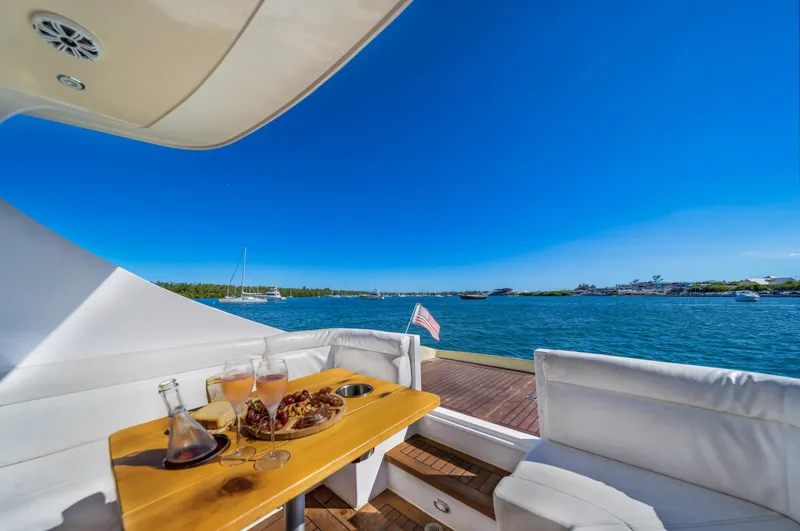 Slide: The Image of Luxurious 2007 Custom NNS Sea Scout 41 yacht with scenic ocean view and dining setup. - 12