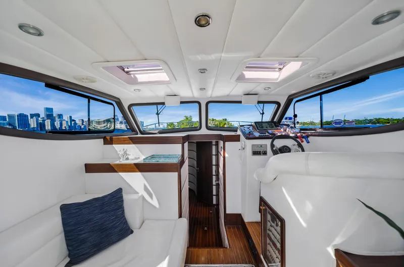 Slide: The Image of Interior of 2007 Custom NNS Sea Scout 41 yacht with city skyline view. - 13