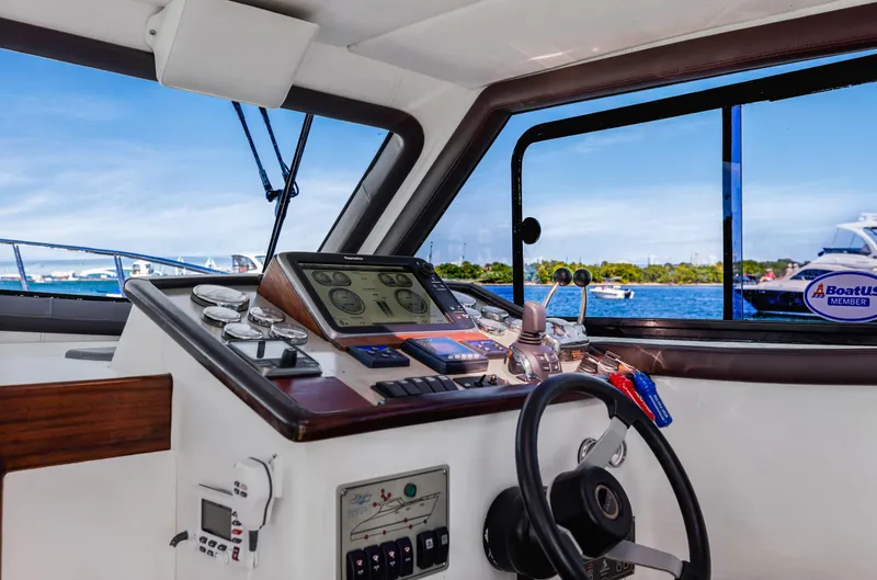 Slide: The Image of Interior helm of 2007 Custom NNS Sea Scout 41 with navigation controls and sea view. - 17
