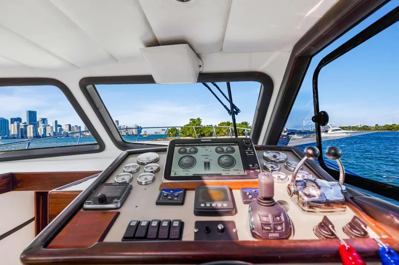 Slide: The Image of Custom NNS Sea Scout 41 yacht cockpit, 2007 model, with city skyline and water view. - 18