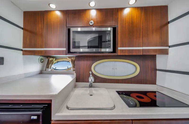 Slide: The Image of Modern kitchen in 2007 Custom NNS Sea Scout 41 yacht with microwave and stovetop. - 20