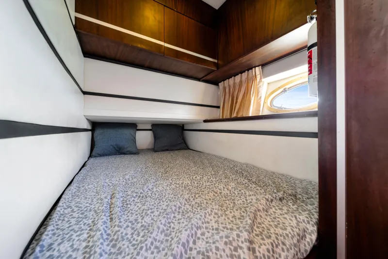 Slide: The Image of Cozy cabin interior of 2007 Custom NNS Sea Scout 41 with bed and window. - 24