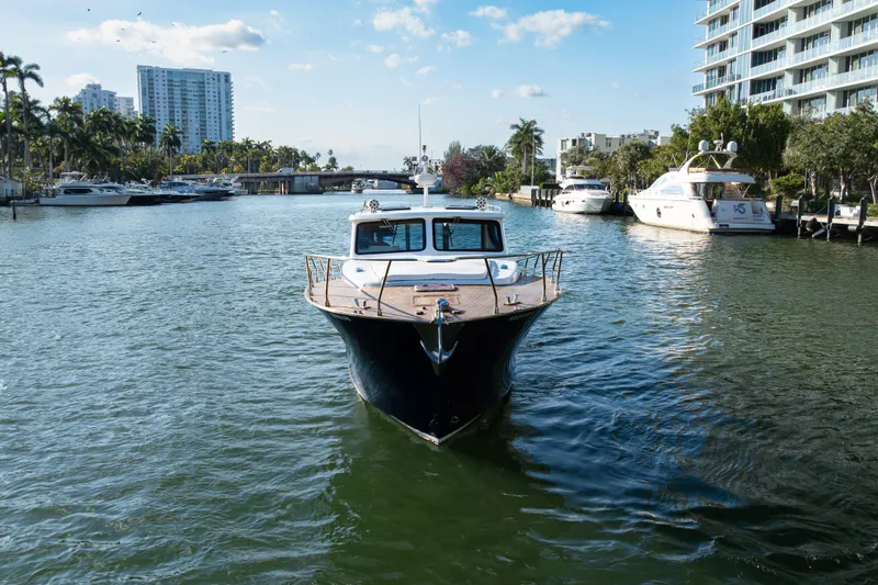 Slide: The Image of Custom NNS Sea Scout 41 yacht, 2007 model, cruising in a scenic marina. - 3