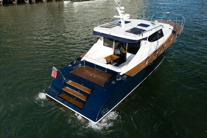 Slide: The Image of Custom NNS Sea Scout 41 yacht, 2007 model, cruising on water with American flag. - 30